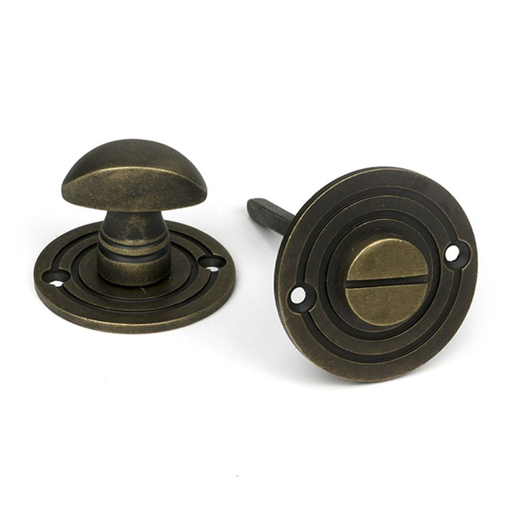 High quality images of the From The Anvil - Burnished Brass Round Bathroom Thumbturn | Sku. Anvil-52462 | available to order from Trade Door Handles, quick delivery at discounted prices.