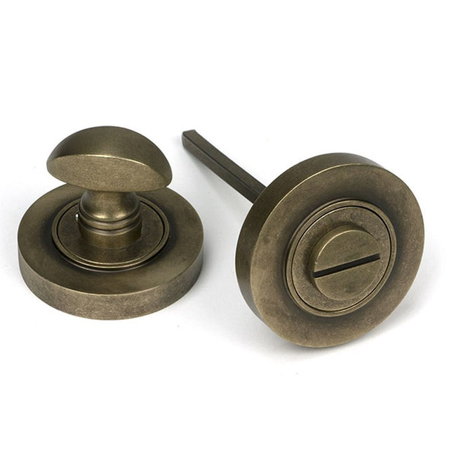High quality images of the From The Anvil - Burnished Brass Round Thumbturn Set (Plain) | Sku. Anvil-52464 | available to order from Trade Door Handles, quick delivery at discounted prices.