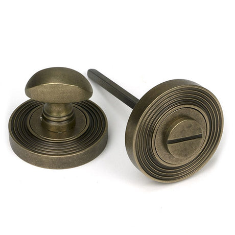 High quality images of the From The Anvil - Burnished Brass Round Thumbturn Set (Beehive) | Sku. Anvil-52466 | available to order from Trade Door Handles, quick delivery at discounted prices.
