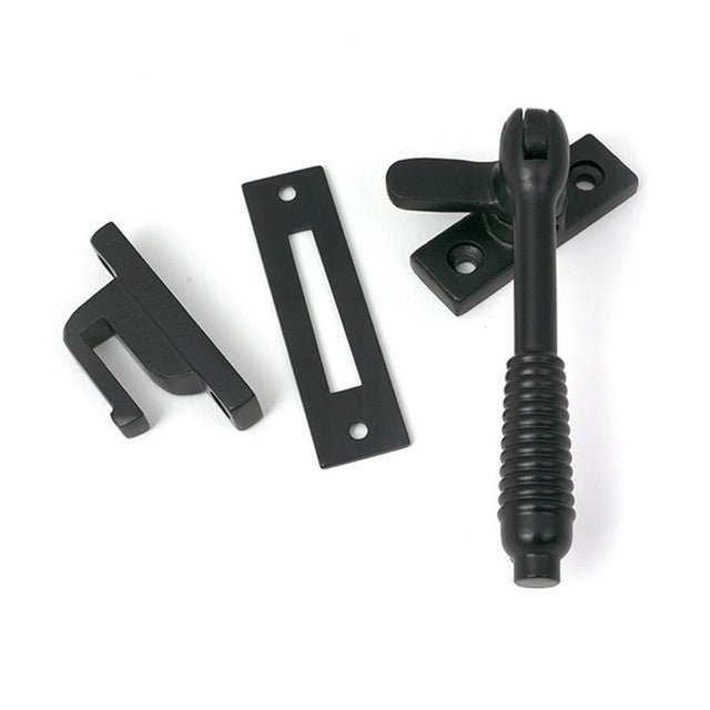 High quality images of the From The Anvil - Matt Black Locking Reeded Fastener | Sku. Anvil-52529 | available to order from Trade Door Handles, quick delivery at discounted prices.