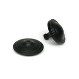 High quality images of the From The Anvil - Matt Black Art Deco Centre Door Knob | Sku. Anvil-52533 | available to order from Trade Door Handles, quick delivery at discounted prices.