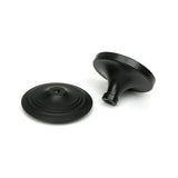 High quality images of the From The Anvil - Matt Black Art Deco Centre Door Knob | Sku. Anvil-52533 | available to order from Trade Door Handles, quick delivery at discounted prices.