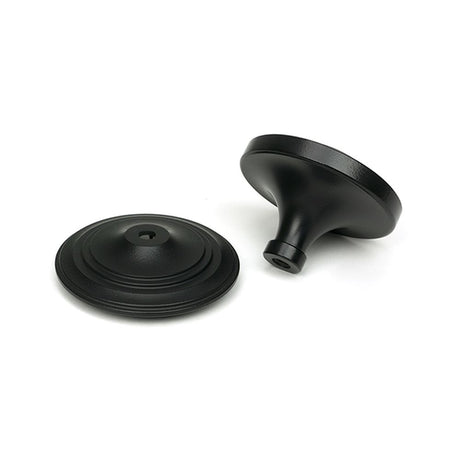 High quality images of the From The Anvil - Matt Black Art Deco Centre Door Knob | Sku. Anvil-52533 | available to order from Trade Door Handles, quick delivery at discounted prices.