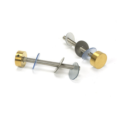 High quality images of the From The Anvil - Aged Brass (304) 100mm Bolt Fixings for T Bar (2) - Offset | Sku. Anvil-52632 | available to order from Trade Door Handles, quick delivery at discounted prices.
