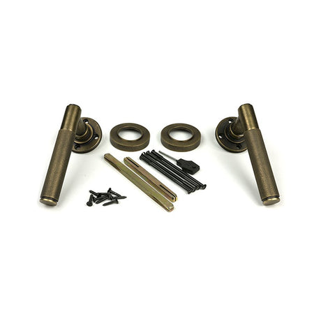 High quality images of the From The Anvil - Burnished Brass Brompton Lever on Rose Set (Plain) - Unsprung | Sku. Anvil-52636 | available to order from Trade Door Handles, quick delivery at discounted prices.