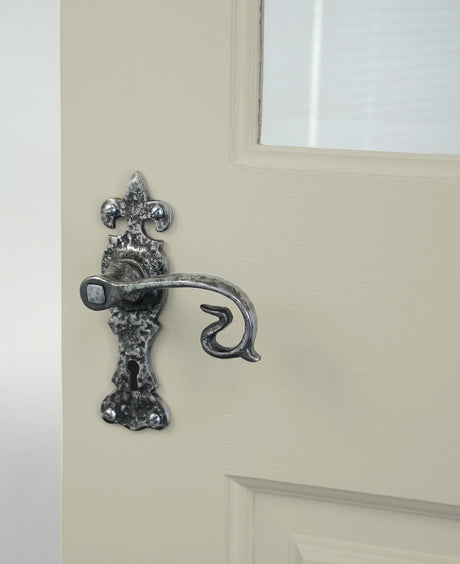 From The Anvil - Natural Textured Curly Lever Lock Set | Sku. 83500 | Trade Door Handles.