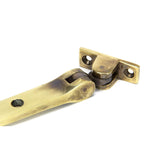 From The Anvil - Aged Brass 10" Monkeytail Stay | Sku. 83568 | Trade Door Handles.