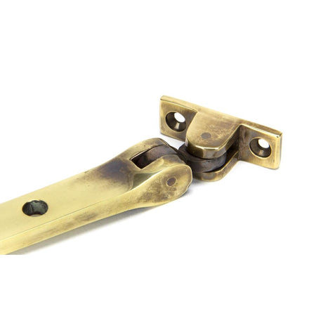 From The Anvil - Aged Brass 10" Monkeytail Stay | Sku. 83568 | Trade Door Handles.
