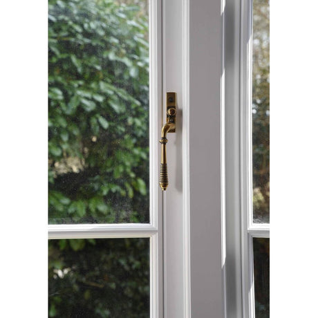 From The Anvil - Aged Brass Reeded Espag - LH | Sku. 83913 | Trade Door Handles.