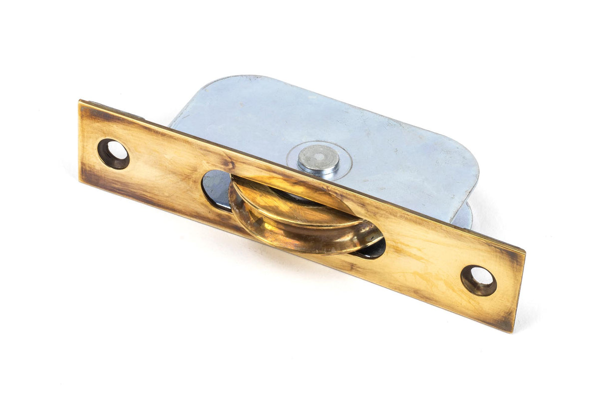 From The Anvil - Aged Brass Square Ended Sash Pulley 75kg | Sku. 83919 | Trade Door Handles.