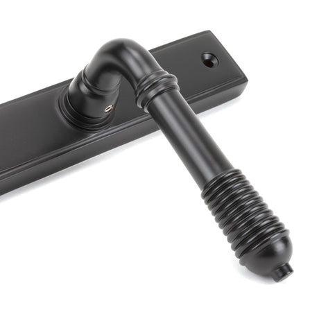 From The Anvil - Aged Bronze Reeded Slimline Lever Espag. Lock Set | Sku. 83952 | Trade Door Handles.