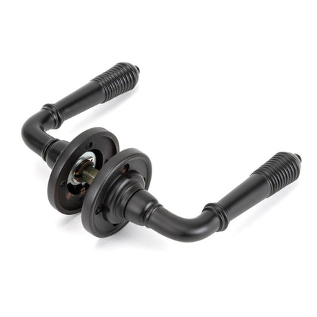 From The Anvil - Aged Bronze Reeded Lever on Rose Set | Sku. 83957 | Trade Door Handles.