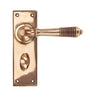 From The Anvil - Polished Bronze Reeded Lever Bathroom Set | Sku. 91915 | Trade Door Handles.
