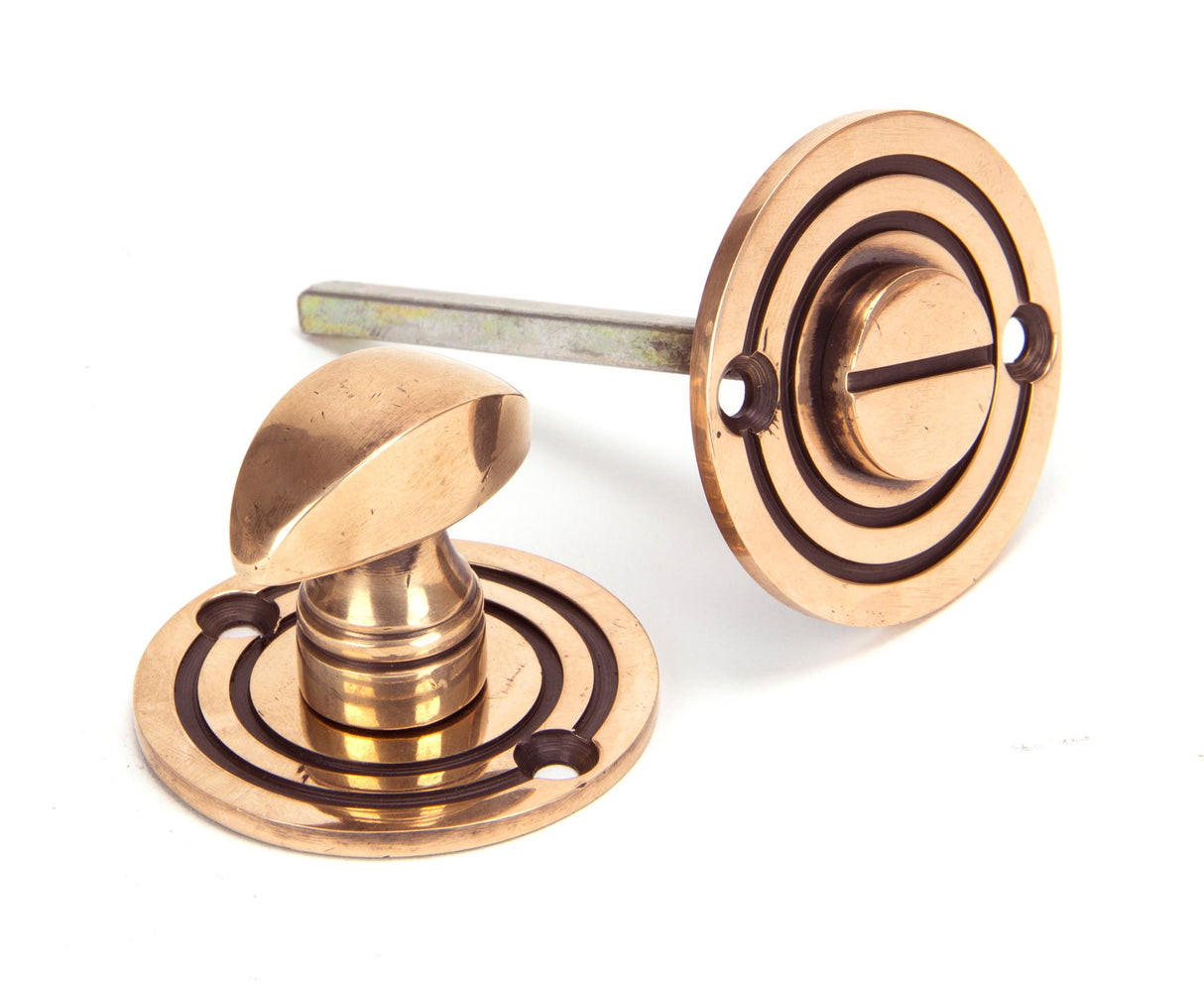 From The Anvil - Polished Bronze Round Bathroom Thumbturn | Sku. 91930 | Trade Door Handles.
