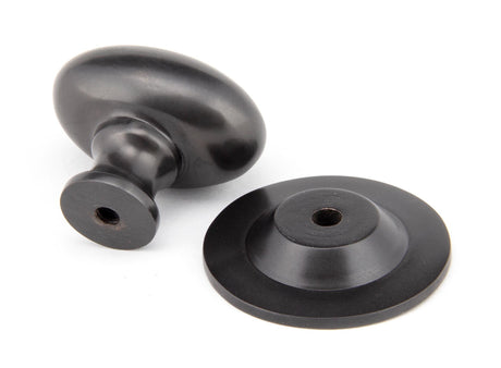 From The Anvil - Aged Bronze Oval Cabinet Knob 33mm | Sku. 92036 | Trade Door Handles.