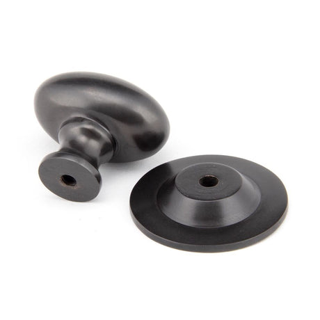 From The Anvil - Aged Bronze Oval Cabinet Knob 33mm | Sku. 92036 | Trade Door Handles.