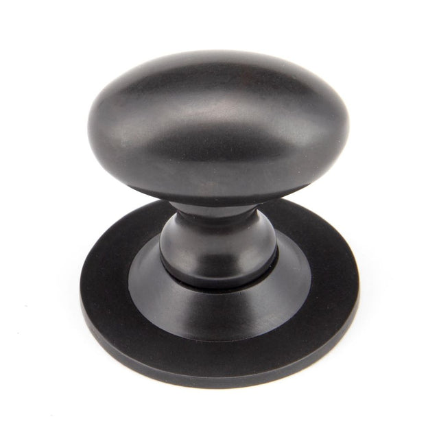 From The Anvil - Aged Bronze Oval Cabinet Knob 33mm | Sku. 92036 | Trade Door Handles.