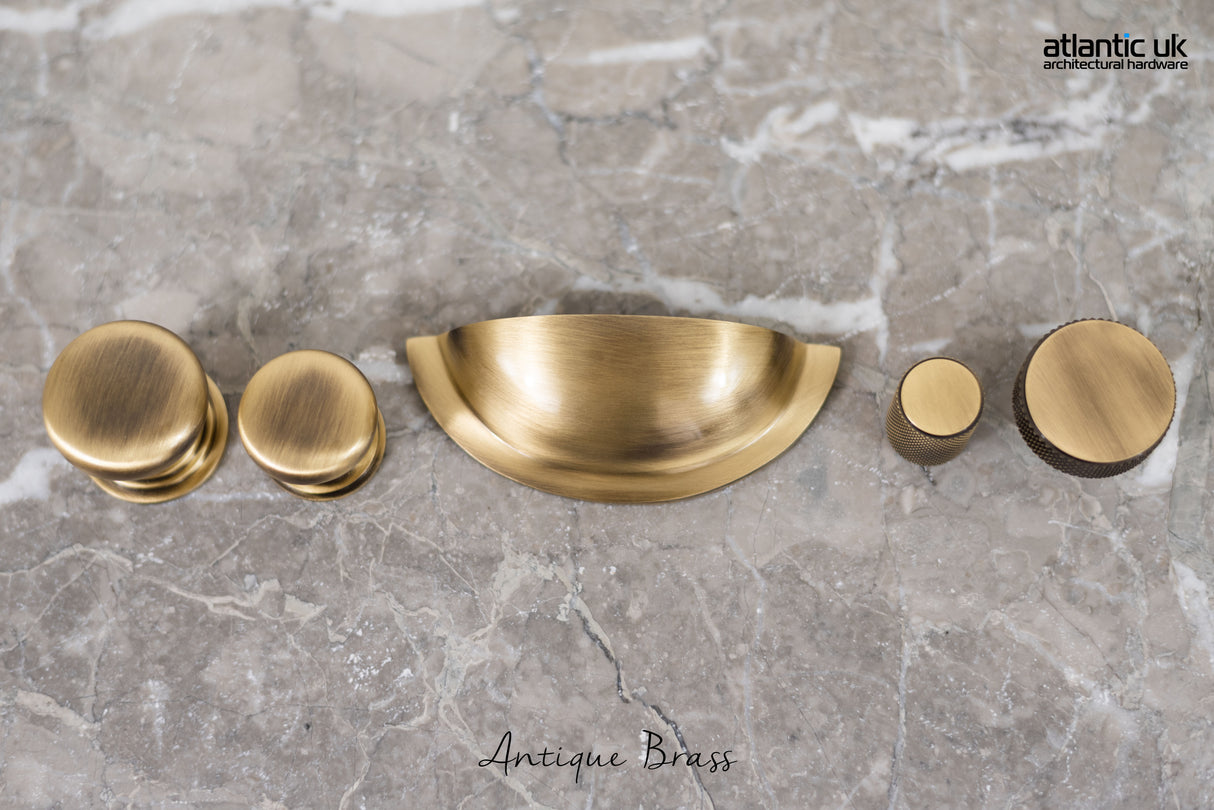 Quality image of Old English Winchester Solid Brass Cabinet Cup Pull on Concealed Fix - Antique Brass | Sku. oec1176ab | available from Trade Door Handles.