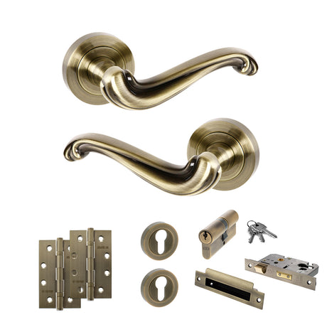 Quality image of Old English Colchester Door Handle Pack (Euro Lock Set - 2.5" CE Sashlock, 4" Slim Knuckle Hinges x2) - Antique Brass | Sku. adpoe177ab24 | available from Trade Door Handles.