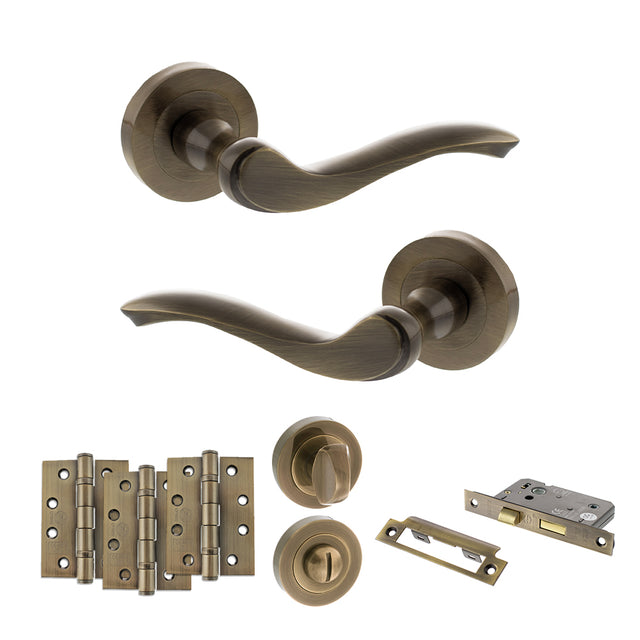 Quality image of Old English Warwick Door Handle Pack (Bathroom Set - 2.5" CE Bathroom Lock, 4" Fire Rated Hinges x3) - Antique Brass | Sku. adpoe178ab10 | available from Trade Door Handles.