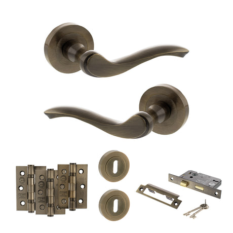 Quality image of Old English Warwick Door Handle Pack (3 Lever Lock Set - 2.5" CE Sashlock, 3" Fire Rated Hinges x3) - Antique Brass | Sku. adpoe178ab14 | available from Trade Door Handles.