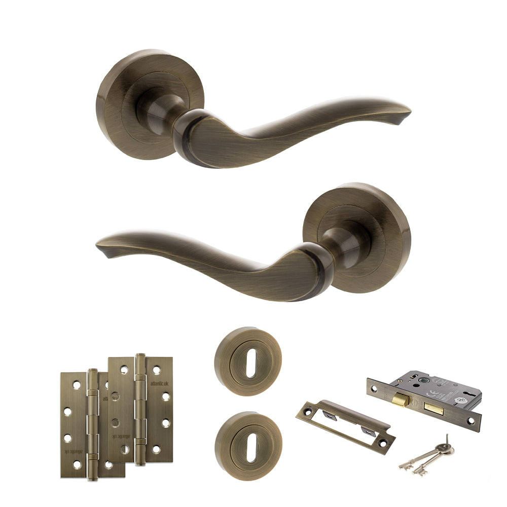 Quality image of Old English Warwick Door Handle Pack (3 Lever Lock Set - 2.5" CE Sashlock, 4" Slim Knuckle Hinges x2) - Antique Brass | Sku. adpoe178ab18 | available from Trade Door Handles.