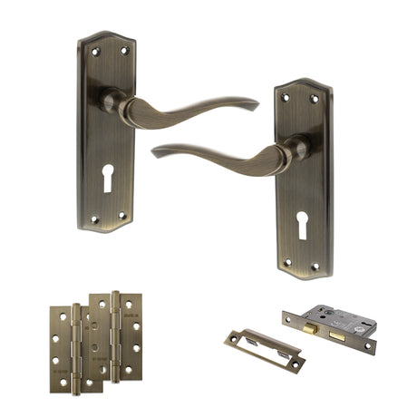 Quality image of Old English Warwick Door Handle Pack (3 Lever Lock Set - 2.5" CE Sashlock, 4" Slim Knuckle Hinges x2) - Antique Brass | Sku. adpoe178kab18 | available from Trade Door Handles.