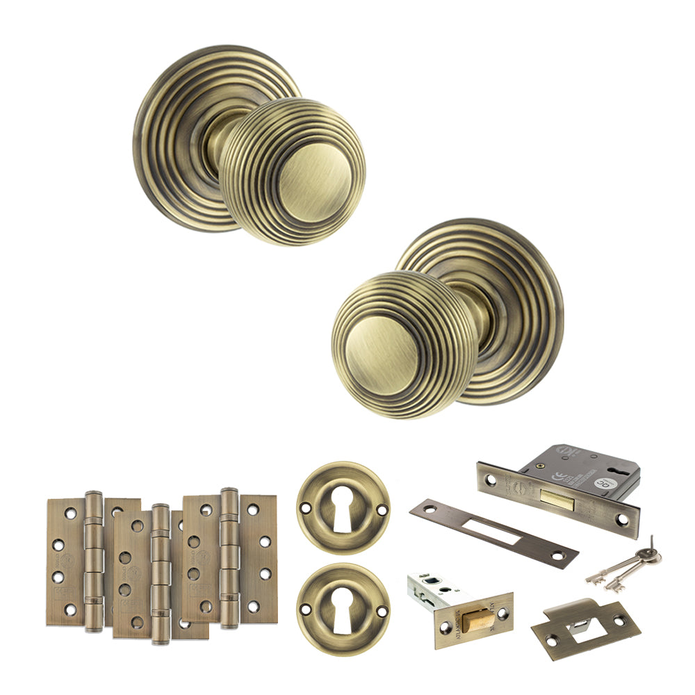 Quality image of Old English Ripon Door Knob Pack (Lock Set - 3" Latch & Deadlock, 4" Fire Rated Hinges x3) - Antique Brass | Sku. adpoe50rmkab67 | available from Trade Door Handles.