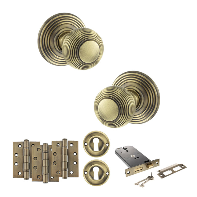 Quality image of Old English Ripon Door Knob Pack (Lock Set - Horizontal Sashlock, 4" Fire Rated Hinges x3) - Antique Brass | Sku. adpoe50rmkab71 | available from Trade Door Handles.