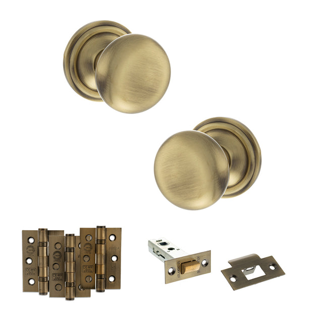 Quality image of Old English Harrogate Door Knob Pack (Latch Set - 3" HD Latch, 3" Fire Rated Hinges x3) - Antique Brass | Sku. adpoe58mmkab54 | available from Trade Door Handles.