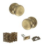 Quality image of Old English Harrogate Door Knob Pack (Latch Set - 4" HD Latch, 3" Fire Rated Hinges x3) - Antique Brass | Sku. adpoe58mmkab55 | available from Trade Door Handles.