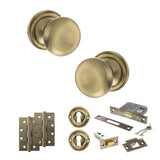 Quality image of Old English Harrogate Door Knob Pack (Lock Set - 3" Latch & Deadlock, 4" Slim Knuckle Hinges x2) - Antique Brass | Sku. adpoe58mmkab68 | available from Trade Door Handles.