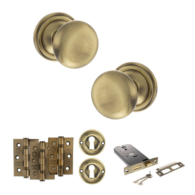 Quality image of Old English Harrogate Door Knob Pack (Lock Set - Horizontal Sashlock, 3" Fire Rated Hinges x3) - Antique Brass | Sku. adpoe58mmkab69 | available from Trade Door Handles.