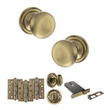 Quality image of Old English Harrogate Door Knob Pack (Lock Set - Horizontal Bathlock, 4" Fire Rated Hinges x3) - Antique Brass | Sku. adpoe58mmkab72 | available from Trade Door Handles.