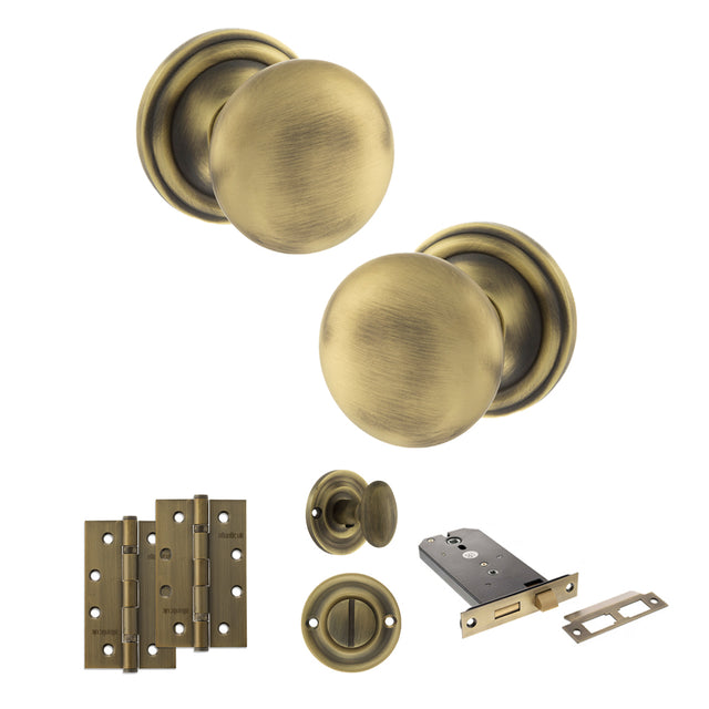 Quality image of Old English Harrogate Door Knob Pack (Lock Set - Horizontal Bathlock, 4" Slim Knuckle Hinges x2) - Matt Antique Brass | Sku. adpoe58mmkmab74 | available from Trade Door Handles.