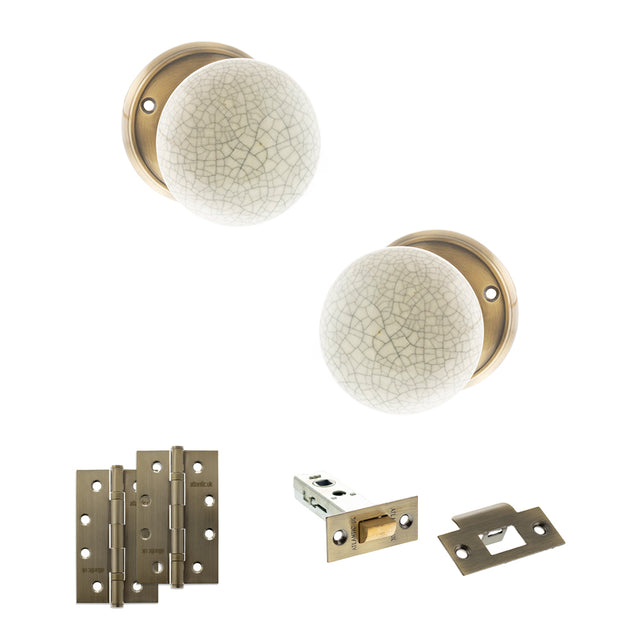 Quality image of Old English Skipton Door Knob Pack (Latch Set - 3" HD Latch, 4" Slim Knuckle Hinges x2) - Antique Brass | Sku. adpoe59cmkcab58 | available from Trade Door Handles.