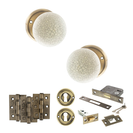 Quality image of Old English Skipton Door Knob Pack (Lock Set - 3" Latch & Deadlock, 3" Fire Rated Hinges x3) - Antique Brass | Sku. adpoe59cmkcab66 | available from Trade Door Handles.