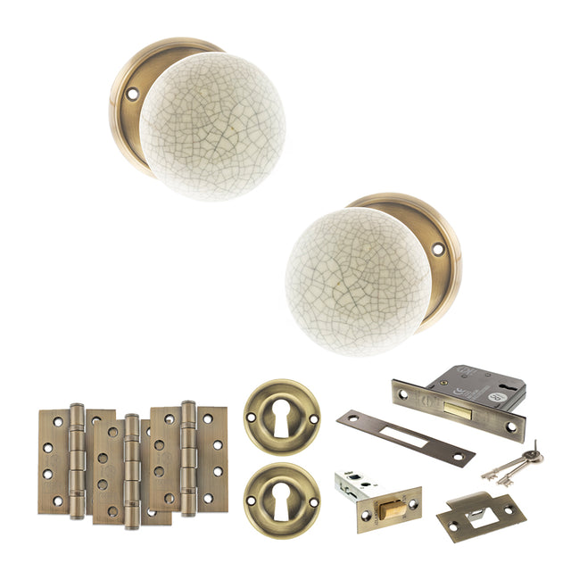 Quality image of Old English Skipton Door Knob Pack (Lock Set - 3" Latch & Deadlock, 4" Fire Rated Hinges x3) - Antique Brass | Sku. adpoe59cmkcab67 | available from Trade Door Handles.