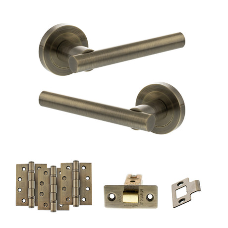 Quality image of STATUS Nebraska Door Handle Pack (Latch Set - 3" CE Latch, 4" Fire Rated Hinges x3) - Antique Brass | Sku. adps28rab4 | available from Trade Door Handles.