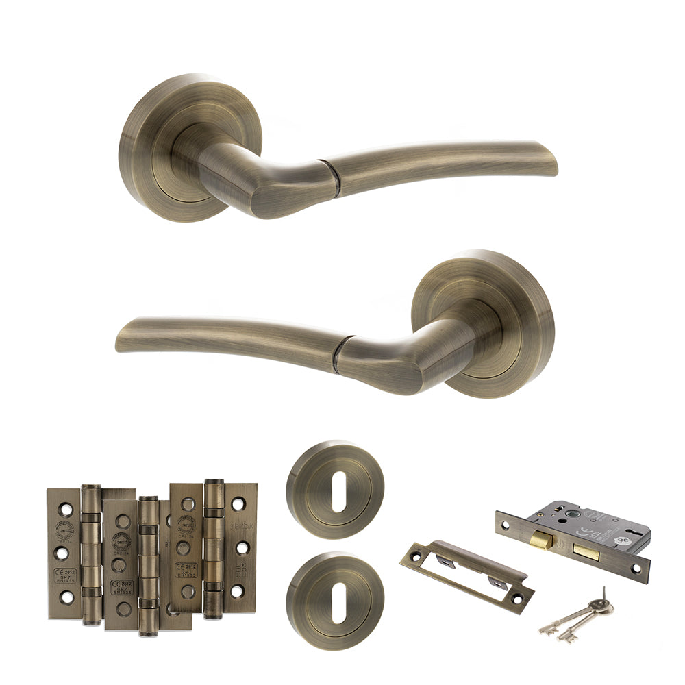 Quality image of STATUS Indiana Door Handle Pack (3 Lever Lock Set - 3" CE Sashlock, 3" Fire Rated Hinges x3) - Antique Brass | Sku. adps33rab15 | available from Trade Door Handles.