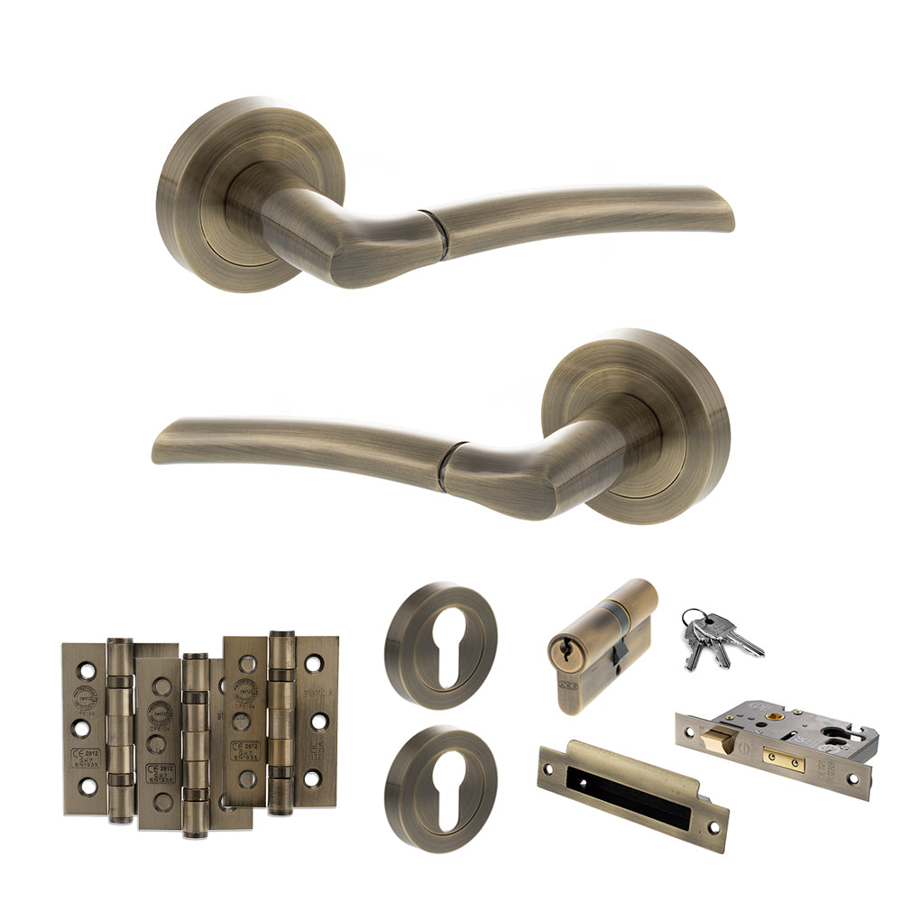 Quality image of STATUS Indiana Door Handle Pack (Euro Lock Set - 3" CE Sashlock, 3" Fire Rated Hinges x3) - Antique Brass | Sku. adps33rab21 | available from Trade Door Handles.