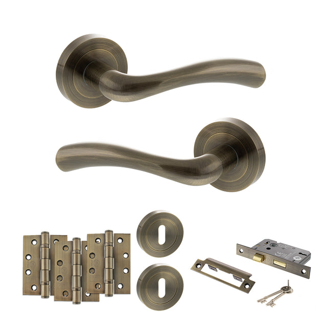 Quality image of STATUS Texas Door Handle Pack (3 Lever Lock Set - 3" CE Sashlock, 4" Fire Rated Hinges x3) - Antique Brass | Sku. adps35rab17 | available from Trade Door Handles.