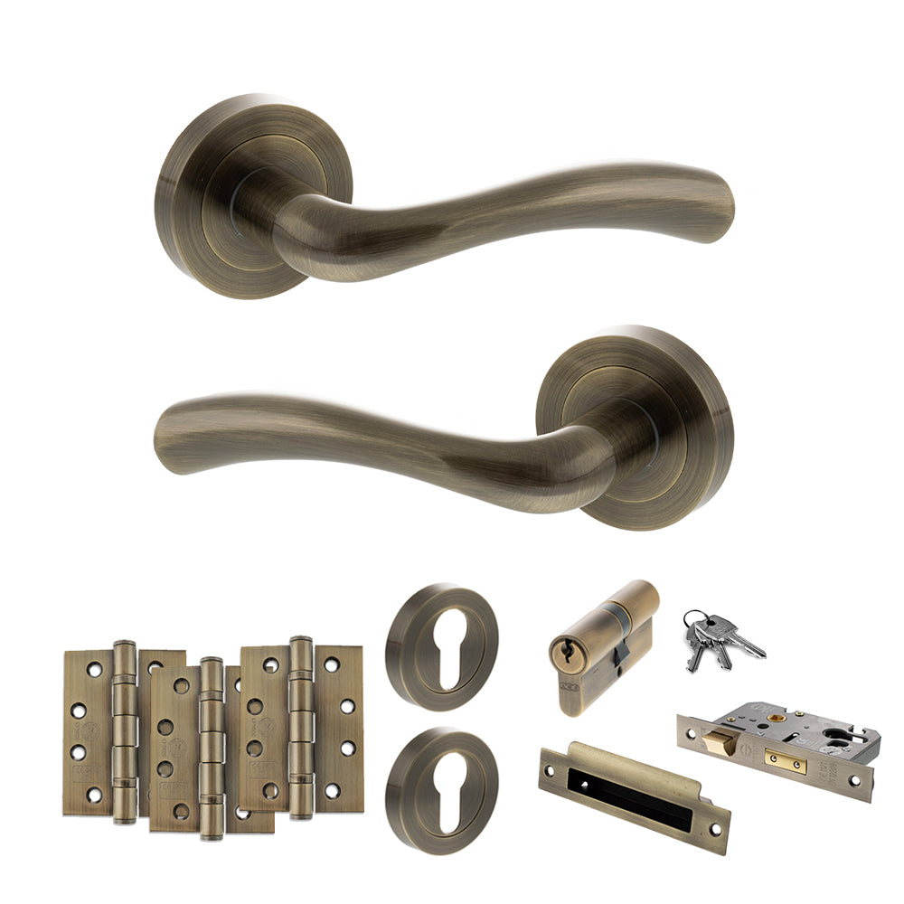 Quality image of STATUS Texas Door Handle Pack (Euro Lock Set - 2.5" CE Sashlock, 4" Fire Rated Hinges x3) - Antique Brass | Sku. adps35rab22 | available from Trade Door Handles.