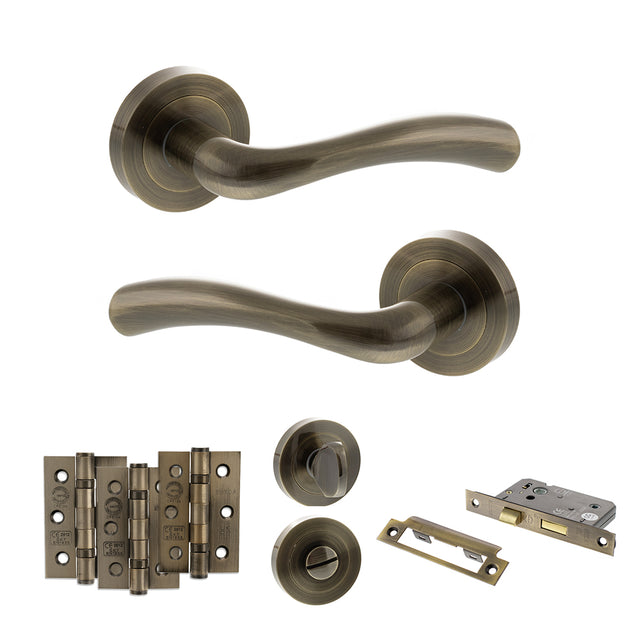 Quality image of STATUS Texas Door Handle Pack (Bathroom Set - 3" CE Bathroom Lock, 3" Fire Rated Hinges x3) - Antique Brass | Sku. adps35rab9 | available from Trade Door Handles.