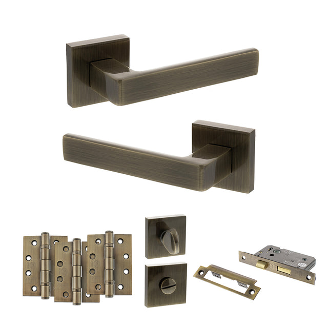 Quality image of STATUS Montana Door Handle Pack (Bathroom Set - 3" CE Bathroom Lock, 4" Fire Rated Hinges x3) - Antique Brass | Sku. adps40sab11 | available from Trade Door Handles.