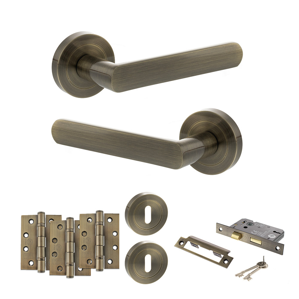 Quality image of STATUS Carolina Door Handle Pack (3 Lever Lock Set - 3" CE Sashlock, 4" Fire Rated Hinges x3) - Antique Brass | Sku. adps42rab17 | available from Trade Door Handles.