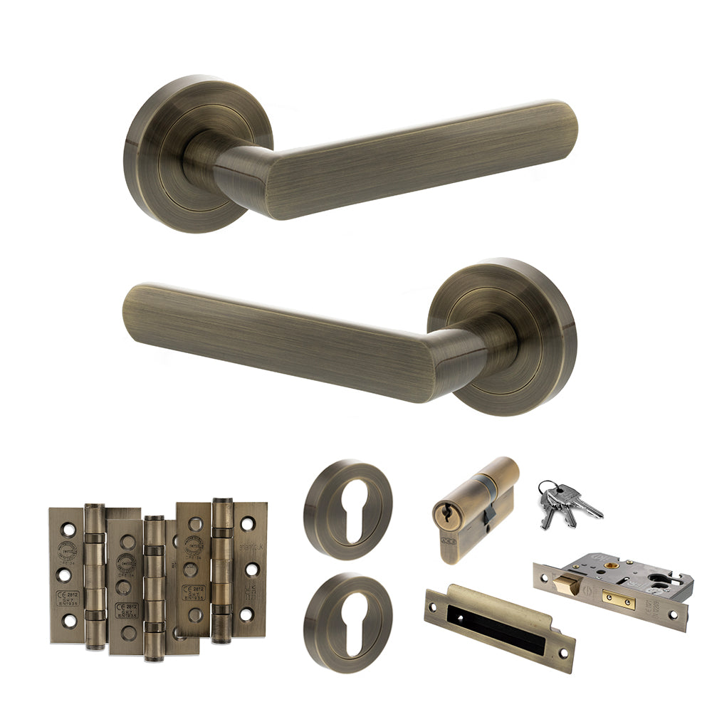 Quality image of STATUS Carolina Door Handle Pack (Euro Lock Set - 2.5" CE Sashlock, 3" Fire Rated Hinges x3) - Antique Brass | Sku. adps42rab20 | available from Trade Door Handles.