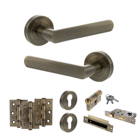 Quality image of STATUS Carolina Door Handle Pack (Euro Lock Set - 2.5" CE Sashlock, 3" Fire Rated Hinges x3) - Antique Brass | Sku. adps42rab20 | available from Trade Door Handles.