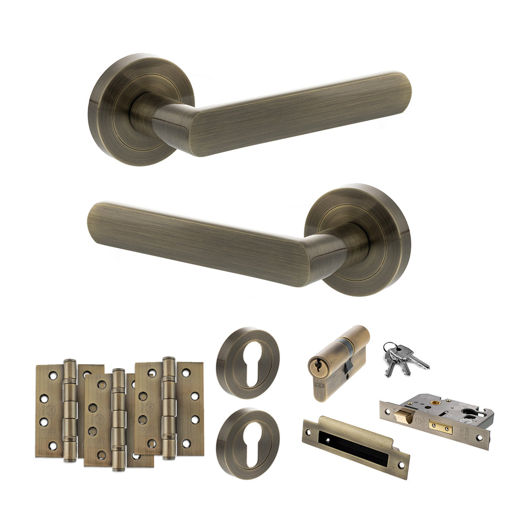 Quality image of STATUS Carolina Door Handle Pack (Euro Lock Set - 2.5" CE Sashlock, 4" Fire Rated Hinges x3) - Antique Brass | Sku. adps42rab22 | available from Trade Door Handles.