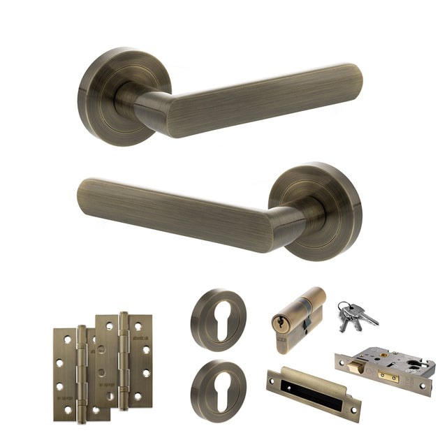 Quality image of STATUS Carolina Door Handle Pack (Euro Lock Set - 2.5" CE Sashlock, 4" Slim Knuckle Hinges x2) - Antique Brass | Sku. adps42rab24 | available from Trade Door Handles.
